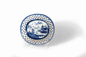 Oval plate in white and blue porcelain with landscape in the center and openwork brim, China, late 18th century