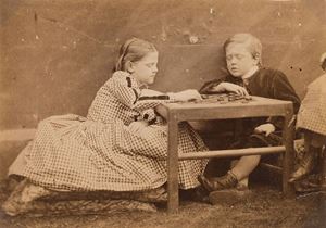 The game of Draughts. Charlotte Edith Denman Arthur Denman ans Grace Deman’s legs