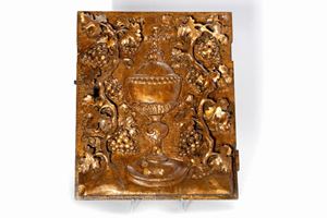 Antique wooden tabernacle door carved with Eucharistic motifs, lacquered and with traces of gilding