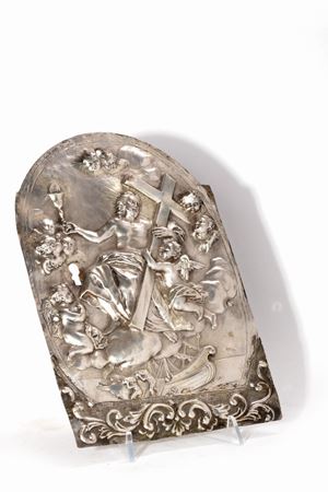 Antique tabernacle door in finely chiseled and embossed silver depicting Christ in glory with cross and Eucharistic chalice, surrounded by cherubs
