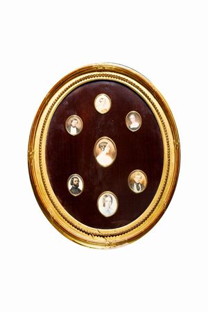 Seven miniatures mounted in a single oval frame, depicting portraits of gentlemen and ladies