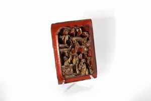 Panel in carved wood and red and gold lacquer depicting figures in a garden, China, Qing dynasty