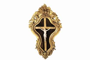 Crucifix in ivory within a polylobed frame in carved and gilded wood, 19th century
