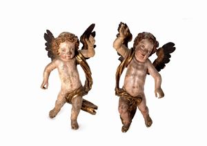 Two angels in lacquered wood, 18th century