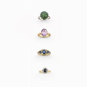 18K yellow gold diamond, sapphire, and amethyst four rings