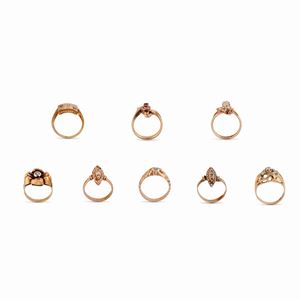 Eight 18K yellow gold, colored and synthetic gemstones rings