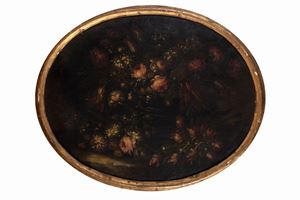 Roses, tulips, carnations and other flowers in a silver vase en plein air