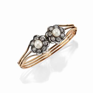 A silver, 18K yellow gold, pearl (prob. natural) and diamond bangle, early 20th Century