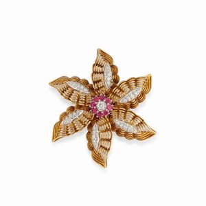 A 18k two-color gold, diamond and ruby brooch, circa 1950