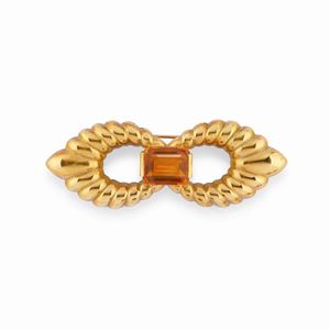 A 18k yellow gold and topaz brooch
