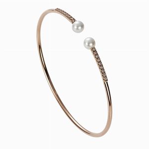 Bracciale rigido in oro, diamanti e perle