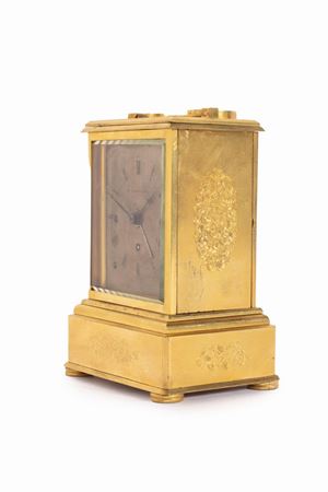 Carriage clock in finely engraved gilt bronze, 19th century
