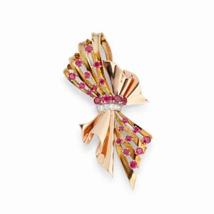  - A platinum and 18K two color gold, ruby and diamond brooch, circa 1940