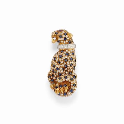 Spilla in oro bicolore 18K a forma di pantera, decorata con diamanti e zaffiri