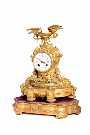  - Table clock in gilded metal, late 19th century