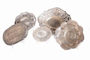  - Lot consisting of four baskets and a saucer in silver, 19th - 20th centuries