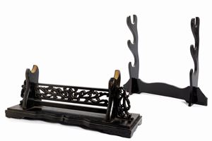  - Two sword holders in ebonized wood, 20th century