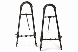  - Two small ebonized wooden easels, early 20th century