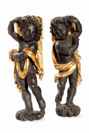  - A pair of lacquered and gilded wooden sculptures depicting angels, 18th century