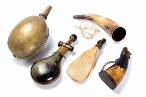  - Lot consisting of four gunpowder holders and a bullet horn, 19th century