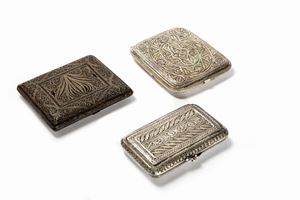 Three silver filigree cigarette holders, 20th century