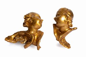 Due teste di cherubini in papier-mâché, secoli XVIII - XIX