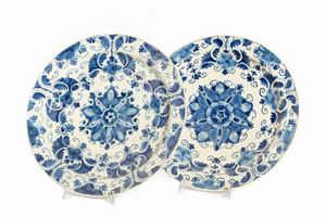 Pair of old blue and white ceramic plates with floral pattern