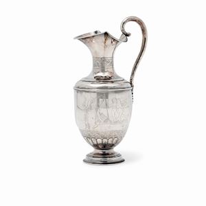A silver pourer (slight defects)
