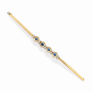 A 18k two-color gold, sapphire and diamond bracelet