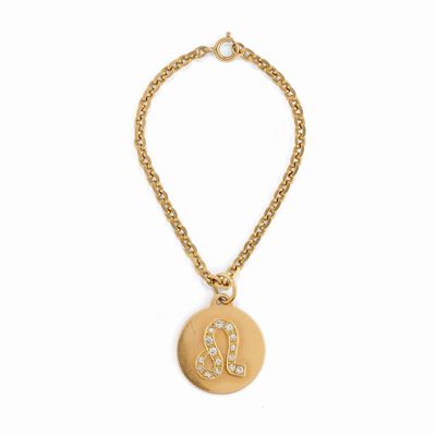 Bracciale in oro giallo 18k con pendente zodiacale del Leone in diamanti