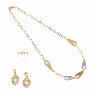 A 18K two color gold and diamond necklace, earrings and ring