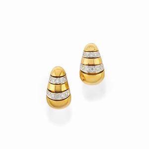 A 18K two color gold and diamond earrings 