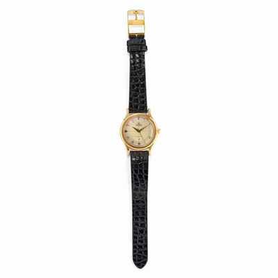 Orologio in oro giallo 18K con quadrante chiaro