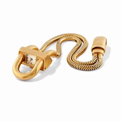 Cassa trapezoidale in oro 18k con bracciale a maglia brasiliana