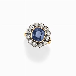 A 18K yellow  gold, silver, sapphire and diamond ring