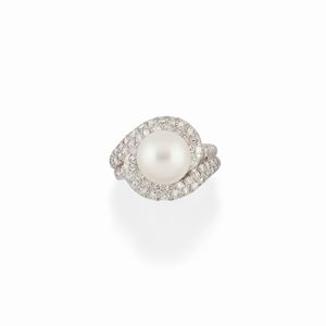A 18K white gold, diamond and cultured pearl ring, with box