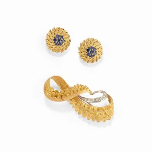 A 18K tow color gold, diamond and sapphire brooch and earrings