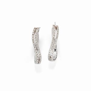 A 18K white gold and diamond earrings 