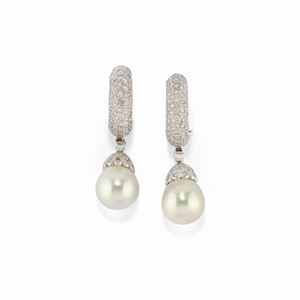 A 18K white gold, pearl and diamond earrings 