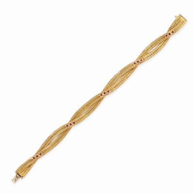 Bracciale in oro giallo 18K con rubini a taglio rotondo