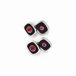 A 18K white gold, onyx, synthetic ruby cufflinks 