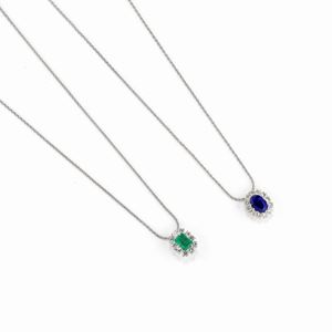 Two 18K white gold, diamonds, emerald and sapphire necklaces