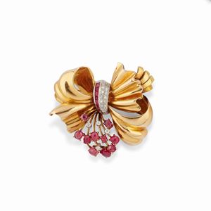 A 18k two-color gold, diamond and ruby brooch, circa 1940