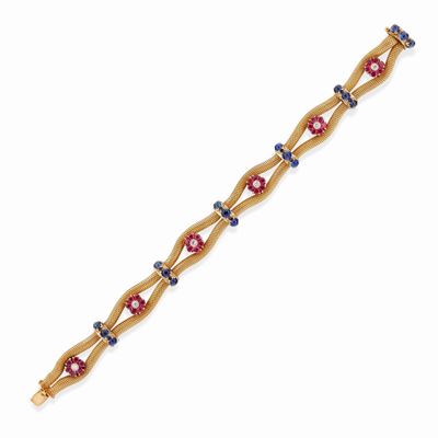 Bracciale in oro giallo 18K con rubini, zaffiri cabochon e diamanti
