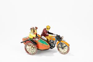 Motorcycle with sidecar with rider and passenger making music