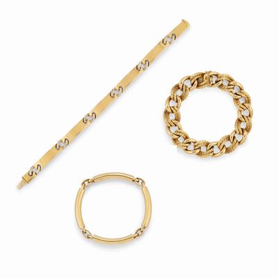 Tre bracciali in oro giallo 18K