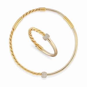 A 18K two color gold and diamonds demi-parure, necklace and bangle
