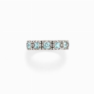 Anello in oro bianco 18k, diamanti e topazi