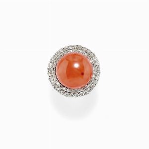 A 9K white gold, diamonds and coral ring