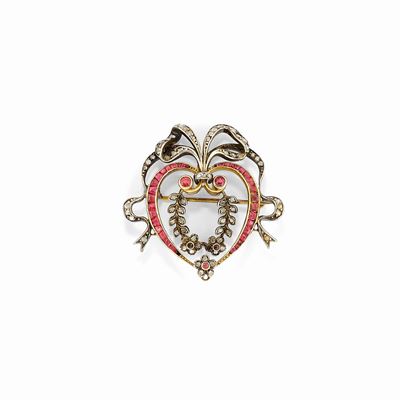 Spilla in oro giallo 18K e argento con diamanti e rubini a forma di fiocco